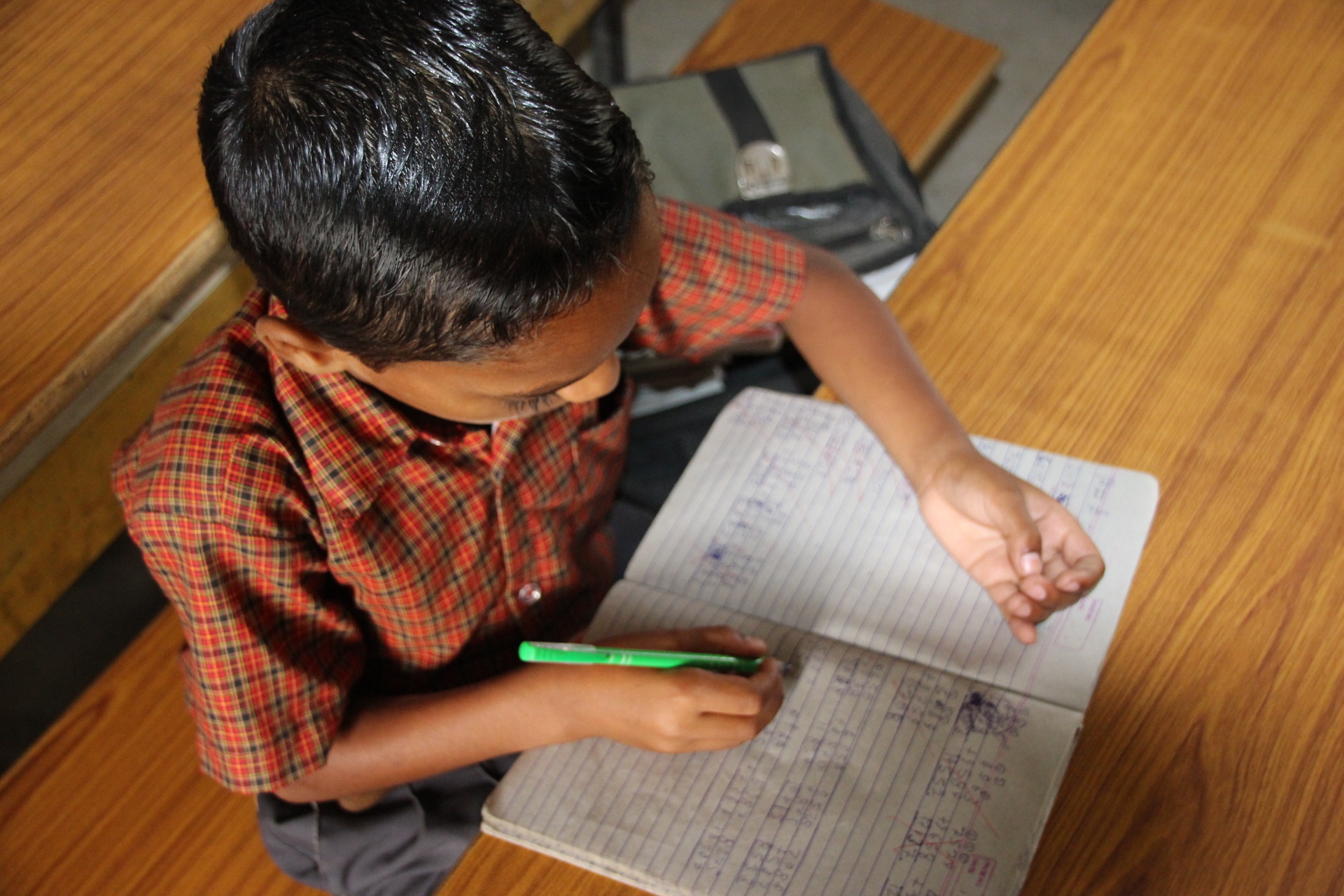 Young boy studying - Care & Fair - Yarns of the East